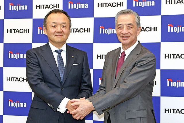 4月、ノジマは日立製作所の家電事業を1100億円で買収。PBの強化を進める。左は日立製作所の網谷憲晴専務、右はノジマの野島廣司社長