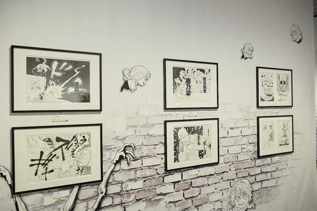 「全冨樫作品の中で一番好きなキャラクターがこのネテロ(展示イラスト中央下)ですね。シンプルに強いですし、それがあんな正拳突きをし続けた賜物だっていうのもすごい。このネテロの最期のシーンは衝撃的でした」