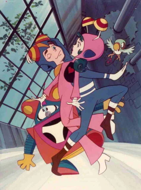 赤黄青を基調にしたコスチュームは、スーパーマンを彷彿させる。ポップアートに加え、アメコミ好きの嗜好も表れている。©タツノコプロ