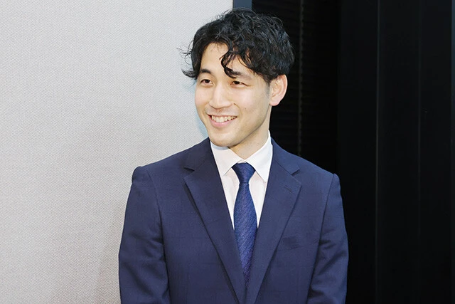 タニタ開発部の和智湧斗さん。タニタが長年積み重ねてきた測定技術をベースに、全身の形状を推定する独自のアルゴリズムを開発