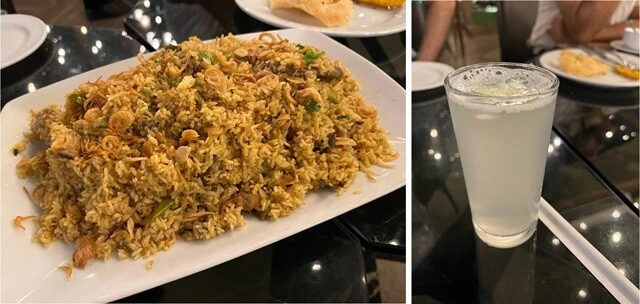チキンビリヤニ（左）と、マムンが勧めてくれたレモンジュース（右）。マムン曰く、「バングラデシュのレモンはおいしい」という。そのジュースは、レモンを絞ってガムシロップをすこし加えただけのものだというが、たしかにおいしかった。かぼすとグレープフルーツとレモンを混ぜたような独特の風味。
